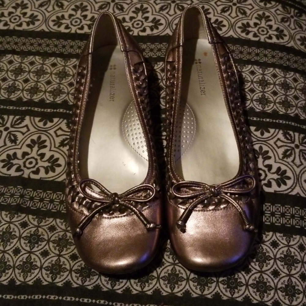 Bronze comfort flats with a slight wedge heel